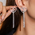 Sparkling silver heart fringe earrings with full rhinestones shown on model - Silver Heart Full Rhinestone Tassel Style (DTE1617105S-W)