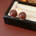 Close-up of elegant silver stud earrings with red-brown gemstone in a premium jewelry box - Silver Earring Post - Coffee