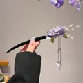 Elegant purple flower hair pin with butterfly charms and dangling golden tassels - Wisteria Flower Tassel Hair Stick
