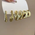 Close-up of three pairs of gold-plated oval C-shaped earrings held in hand for detail - 24# Steel Pin (6-Piece Set) / Gold