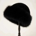 Winter plush faux fur bucket hat in black displayed on a wooden stand for outdoors - Black