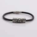 Detail of gothic silver cross cylinder charm on black leather rope bracelet for men - Platinum V