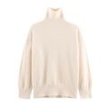 Detailed view of the ribbed knit turtleneck and shoulder seam on this cream sweater - S / Apricot