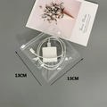 Detailed view of 13cm x 13cm transparent jewelry zipper bag with charging cables inside - 30 Silk 13*13cm (100 Pcs)