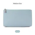 Medium powder blue PU leather makeup pouch with cross-grain texture and silver zipper - Medium Pink Blue