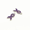 Macro view of purple enamel ribbon charms with silver metal edges for DIY jewelry - Purple