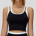 Two-piece style sports bra in black and white color block for yoga and fitness training - S / Premium Black