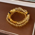 Detail of multi-layer white crystal bracelet with yellow beads and gold floral spacers - Multi Loop Yellow Crystal Retro Blessing Style (23#)