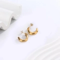Macro shot of chunky 18K gold plated U-shaped hoop earrings on white textured background - C-shaped Smooth Surface