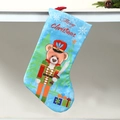 Blue Christmas stocking featuring a Nutcracker bear and Merry Christmas embroidery detail - Blue Nutcracker Bear
