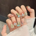 Handmade orange leopard print press-on nails with 3D floral accents and golden charms - Large (L) / Short Duckbill (646)