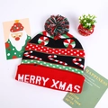 Detailed view of festive Christmas knit hat with LED lights and Merry Xmas lettering - Red Black Candy Cane Merry Xmas