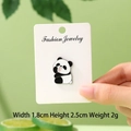 Cute enamel panda brooch with a playful expression on a Fashion Jewelry display card - Tongue Out Panda
