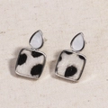 Silver drop earrings with white stone and black and white cow print fur square pendant - White Gold