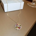 Detail of vintage gold flower necklace with colorful zircon gemstones on a white box - 74# Necklace Zircon Flower (Real Gold Plated)