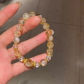 Detailed shot of yellow quartz beaded bracelet with zircon flower and gold accents - Flower Tower Crystal Tiger Eye Adjustable (Exquisite Gift Box)