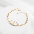 Detail of 18K gold plated bracelet featuring a pink enamel Aquarius zodiac pendant and gems - Aquarius