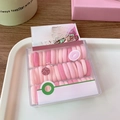 Close-up of pink macaron color baby size hair ties in cereal box style packaging - 40 Pcs/Box / Pink Gradient