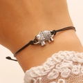 Adjustable black braided rope bracelet featuring a detailed silver elephant charm on a wrist - Woven Rope Elephant Bracelet (3402) / White K