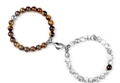 Tiger eye and white turquoise couples magnetic heart bracelet set in a flat lay view - Tiger Eye + Synthetic White Turquoise