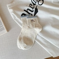 Cute cream puppy socks with colorful nep yarn dots and light blue ribbed cuff detail - One Size / Blue Edge