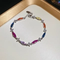 Detailed close-up of adjustable silver bracelet with colorful marquise-cut zircons - Colorful