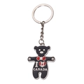 Portachiavi orsetto di metallo nero con cuore bandiera Canada e fiocco rosso su bianco - Orso Teddy Nero I❤CANADA