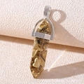 Detail of bullet-shaped resin pendant filled with gold stones and silver metal clasp - Resin Goldstone