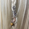 Detail of silver spiral hair jewelry with moon, star charms and tiger eye bead on braids - Moon Star Tiger Eye