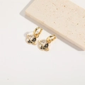 Detalle de pendientes de planeta dorados con esmalte bicolor y cristales finos - Negro