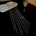 Elegant gold metal claw clip with sparkling rhinestones and long tassel fringe - Gold Black Zircon Tassel Style
