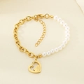 Detail of gold titanium chain bracelet with pearls and engraved heart pendant charms - Hug Heart Zirconia (KB203706-Z)