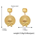 Detailed view of titanium steel golden bow earrings with woven texture and dimensions - Round Straw Hat Style / Gold