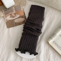 Dark coffee knit leg warmers with vertical ribs and ruffled edges in a cozy setting - One Size / Dark Gray