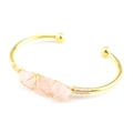 Detail of handmade gold wire wrapped pink natural raw crystal stones on open cuff bracelet - Rose Quartz