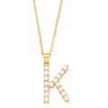 Detailed close-up of a gold-plated letter K pendant adorned with white pearls on a chain - Letter K