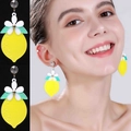 Vibrant yellow acrylic lemon slice earrings with floral detail and crystal stud on model - Floral Lemon