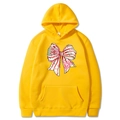 Ginger yellow Christmas hoodie featuring holiday bow print and front kangaroo pocket - Yellow