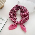 Pink heart patterned cotton-linen neck scarf tied in a stylish knot on a white desk - Pink Dots