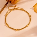 Detail of double-layer gold stainless steel twist chain bracelet with bead accents - Gold Round Bead Style