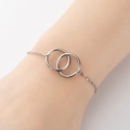 Elegante bracciale a due anelli intrecciati in argento da donna in stile minimalista - Color Acciaio