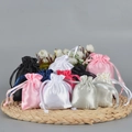 Assorted satin silk drawstring gift bags in multiple colors on a woven straw mat - 20*25cm / Random Mixed Colors