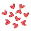 Macro view of multiple red heart enamel pendants with golden beaded edge for DIY jewelry - Heart-shaped Beaded Style / Red