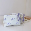 Detail of floral cotton pouches featuring rope zippers and delicate bow prints - White Base Light Purple Bow