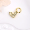 Macro shot of gold V-shaped charm with clear zircons and round ring for DIY jewelry - White