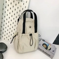 Mini mochila de nailon beige con asas dobles negras y cordones laterales ajustables - Blanco Roto