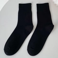 Classic solid black crew socks with ribbed cuffs and reinforced heel for daily wear - One Size / Black