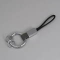 Porte-clés créatif en cuir tressé noir avec anneau argenté et boucle métallique - Gris + Argent