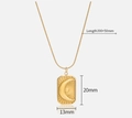 Collier en acier titane doré avec pendentif relief soleil lune et ses dimensions - Collier Plaque Lune