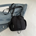 Minimalist black nylon drawstring bucket bag with mesh pocket and adjustable strap - Black